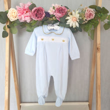 Load image into Gallery viewer, Baby boys pale blue and gold traditional Spanish style babygrow with its adorable smocked detail and peter pan collar