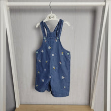 Load image into Gallery viewer, Dark denim floral dungarees for baby girl, gorgeous embroidered floral design all over the front, adjuatable straps for longer wear, light airy material perfect for summer holidays, wear as is or pair with a t-shirt or long sleeved top