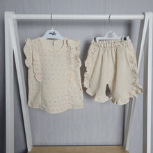 Load image into Gallery viewer, Luxury high end brand, gorgeous two piece shorts and blouse set for little girls, adorable frill detailing to both pieces, gorgeous cream colour with pastel polka dot design, a real showstopper. Stunning outfit for baby girl
