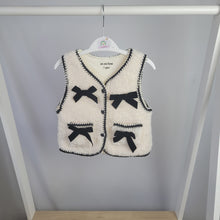 Load image into Gallery viewer, Cream Borg Gilet with Black Bows
