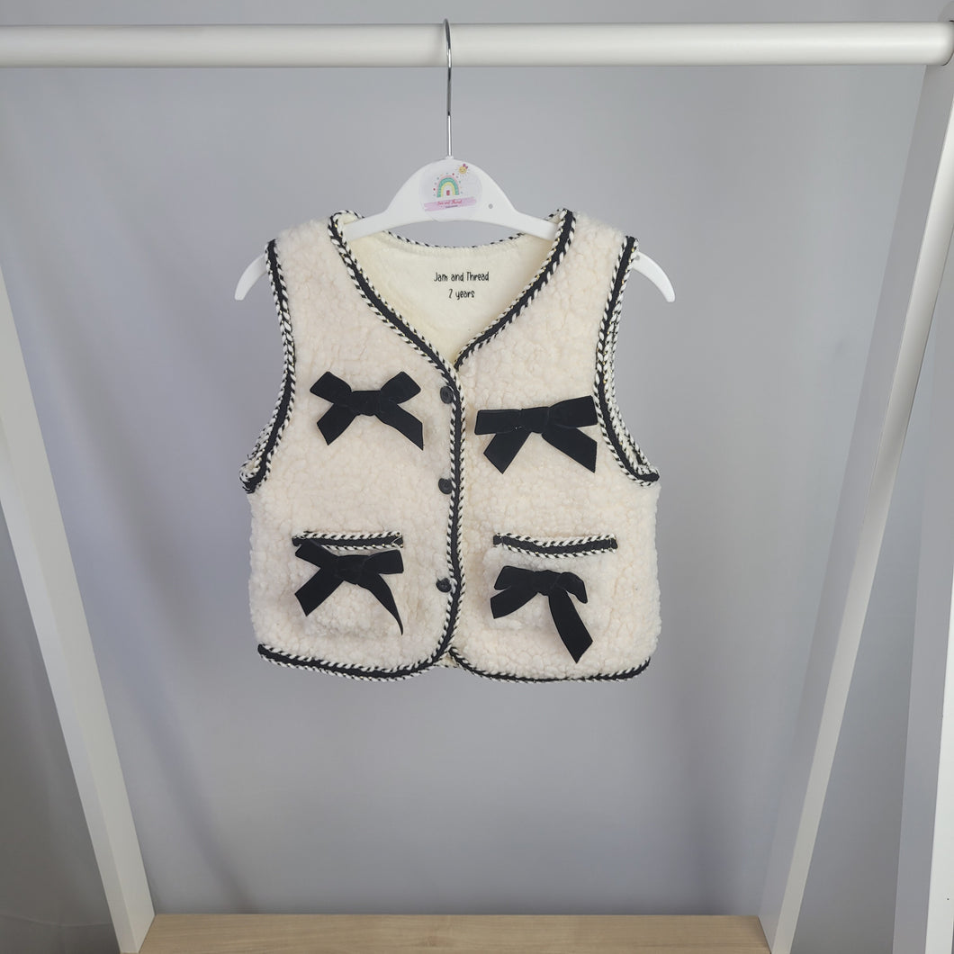 Cream Borg Gilet with Black Bows