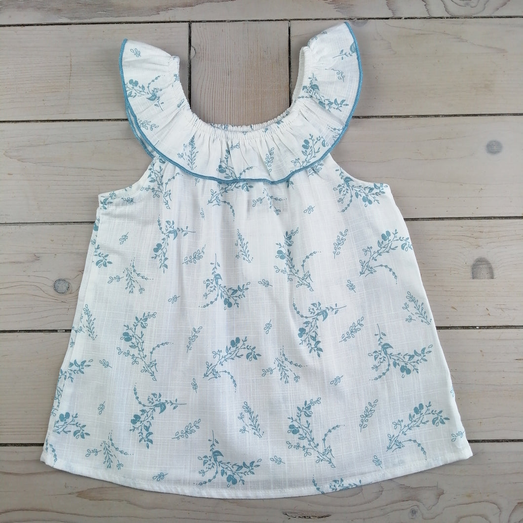 Girls white and blue sleeveless blouse with ruffle collar